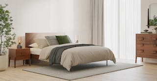 An airy modern bedroom featuring The Modern Day curated design