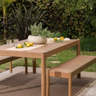 Lush backyard dining space featuring the Rosa 75" Outdoor Dining Table Set. Photo by @charlotteleaphotography