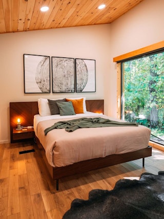 Nera Bed with Nightstands featured in a warm woodland cabin, Credit Hillside Amble