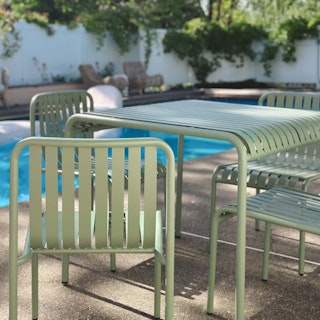 Poolside patio featuring Sarek 35.5" Outdoor Dining Table in Khaki Green. Photo by @ponderosa_and_plaid