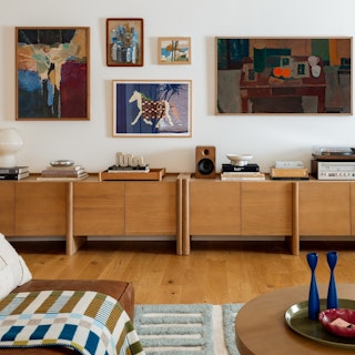 Torme 72" Media Unit - White Oak, styled in a bright room filled with colorful art and textiles