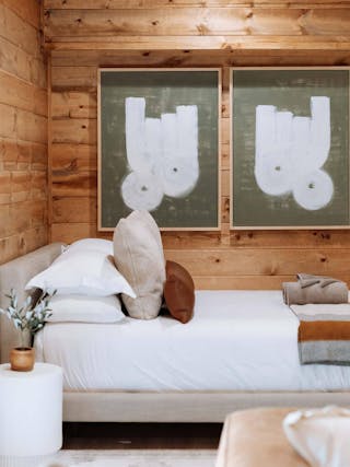 Tessu Queen Upholstered Bed featured in a cozy wood cottage, Credit The Everwoods