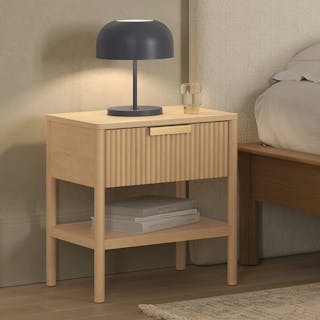 The Liv 1-Drawer Nightstand White Oak styled with a bedside lamp