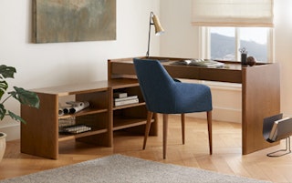 A styled office with plants, featuring Torme L-Shape Desk Set in Smoked Oak finish
