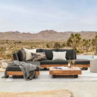 Lubek Corner Sectional Set in Slate Gray, set on a patio in a desert