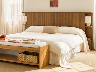 a warm mid-century modern bedroom featuring Kouva headboard and Basi bed in smoked oak 