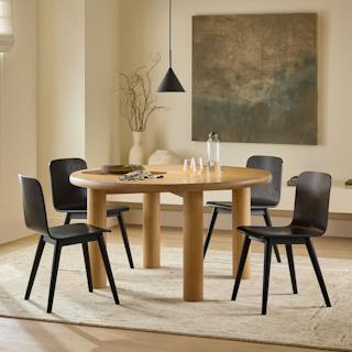Bright airy dining space featuring the Adel 55.5" Dining Table in Smoked Oak