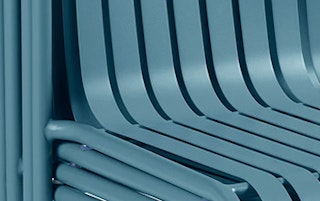 Detail view of the Sarek Outdoor Stackable Dining Chair in Peacock Blue