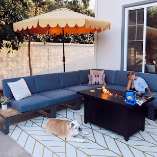 Custom corner sofa featuring Kezia 100" Outdoor Corner Modular Sectional with extra Kezia 28" Outdoor Armless Chair Modules. Photo by @colby_tice