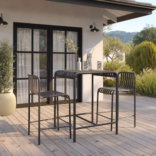 Sunny patio styled with the Sarek Outdoor Bar Table and Counter Chairs in Taupe